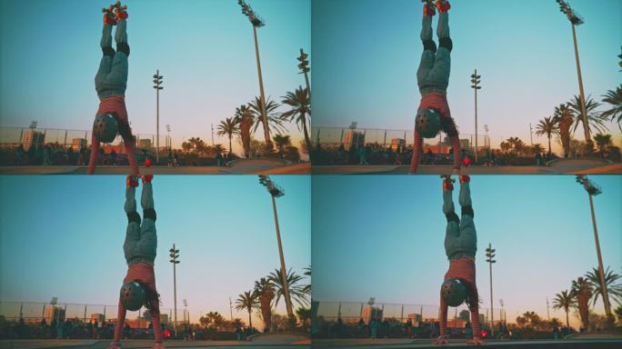 女子轮滑运动员在滑冰公园表演倒立