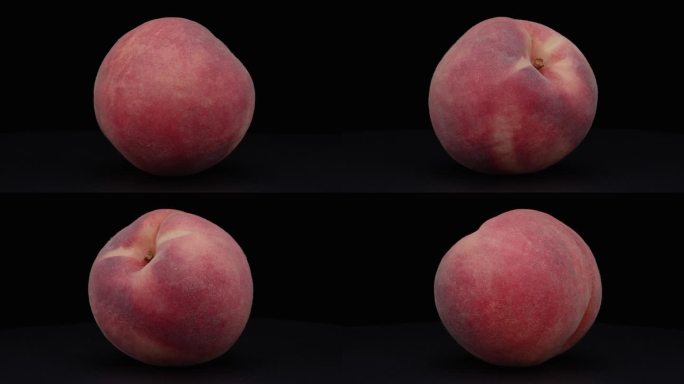 4K视频：一颗桃子在黑色背景上旋转。