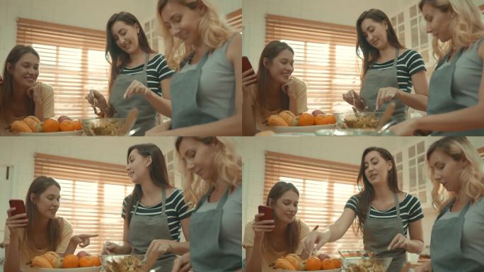 女团正在厨房里享受准备食物和跳舞的乐趣