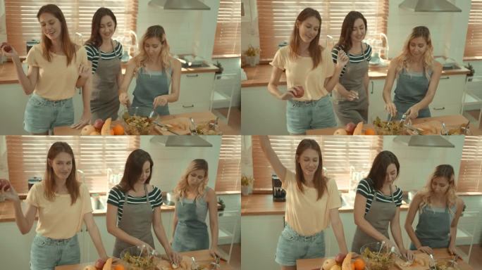 女团正在厨房里享受准备食物和跳舞的乐趣