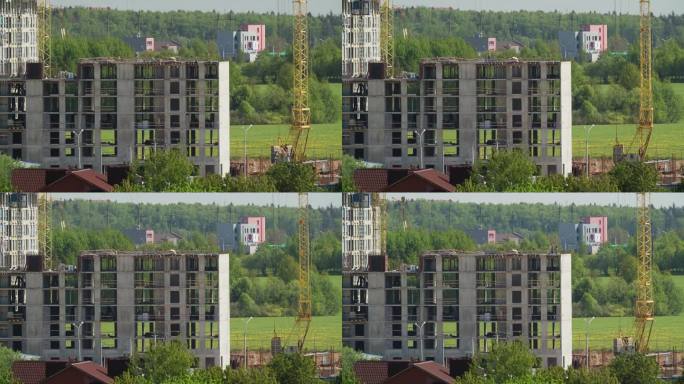 施工起重机用于新建多层住宅的施工。起重机在工作。新建多层住宅的延时施工与开发。房地产