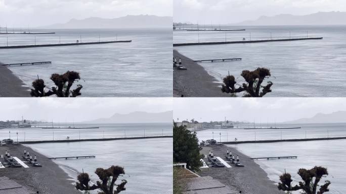 一名骑自行车的人在大雨中寻找避雨处。