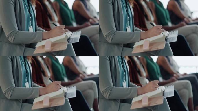 商务人士在办公室开会、研讨会或员工培训工作坊时，用手和书写本子。女性或员工在会议中为日程安排、计划或