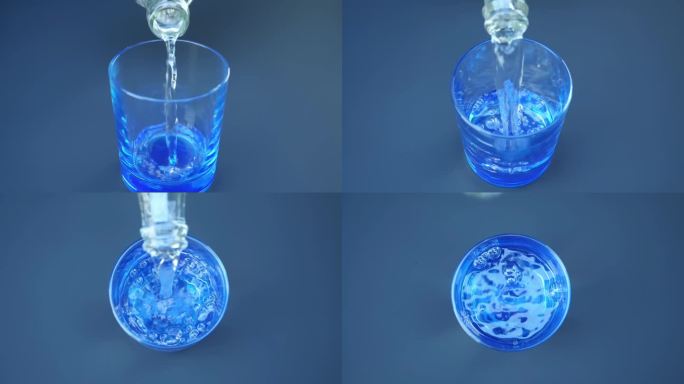 干净的、闪闪发光的淡水从塑料瓶里倒进玻璃杯里