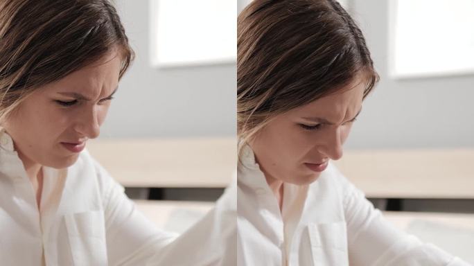 肘部疼痛，关节疼痛。有痛风或关节炎症状的女性用手触摸手臂和肘部。手关节发炎的妇女特写