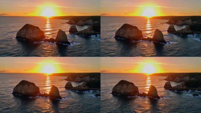 金色夕阳下的海岛礁石