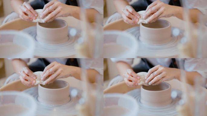 女人在陶艺轮上制作陶瓷作品