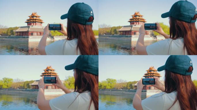 年轻女子在紫禁城拍照——中国北京