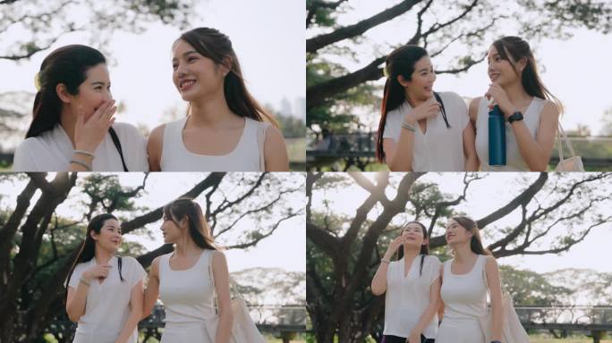 晚上在公园散步。两个亚洲女人在阳光明媚的公园里享受清晨的散步