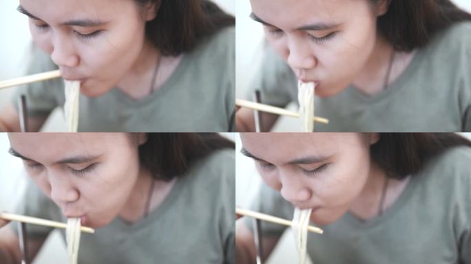 年轻女子在餐厅吃一碗味噌拉面