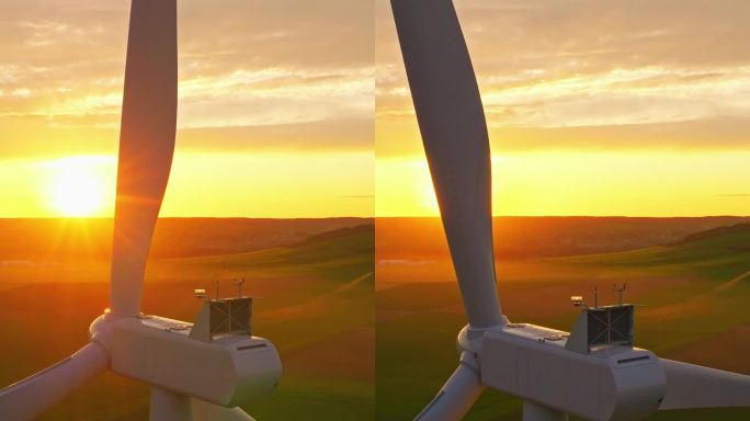 工作中的风电场，日落美景。鸟瞰图Windpark与风力涡轮机，风车。理念:电厂、气候变化、可持续资源