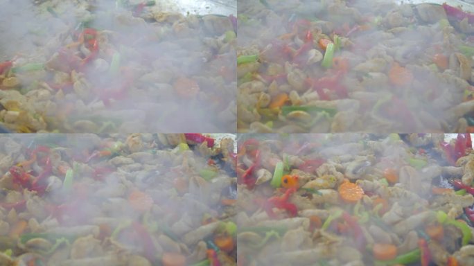咝咝作响的肉和蔬菜在一个大盘子里用4k慢动作120fps炒