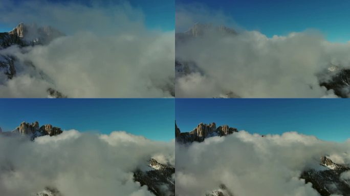 在山间穿越云层飞行