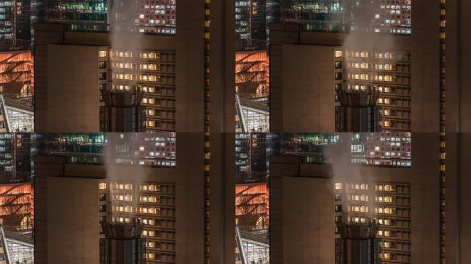 夜晚烟雾暖气与窗灯的都市风光