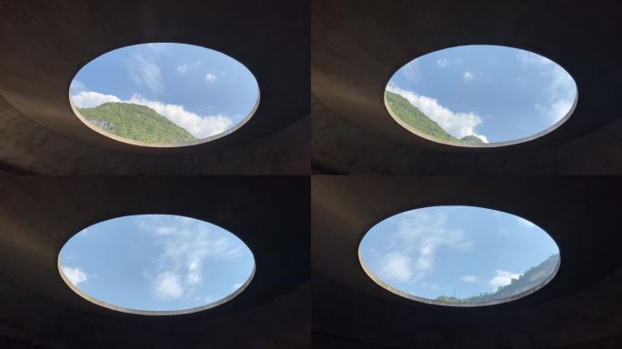 圆形窗口外的天空与山景