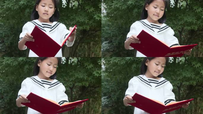 女孩开心翻开荣誉证书观看慢动作