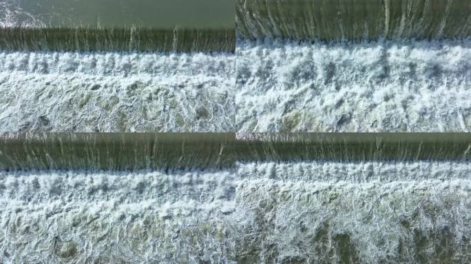 4k航拍水坝泄洪水流湍急的阶梯式瀑布