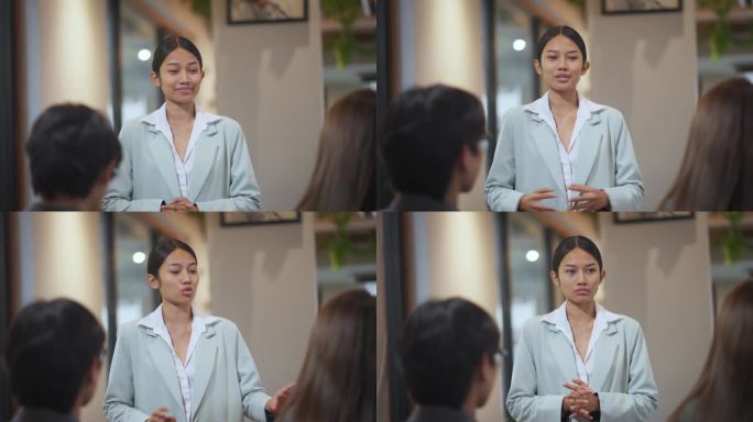 自信的女商人在会议上向团队展示战略。