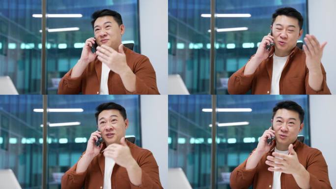 自信的亚洲商人在现代办公室的工作场所坐着，打着手机。