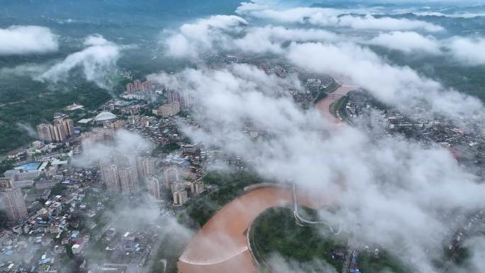 航拍雨后城市风光云雾缭绕的城市景观
