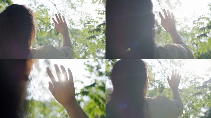 唯美女孩伸手触摸阳光