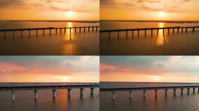 夕阳下运煤货运火车行驶在大桥上