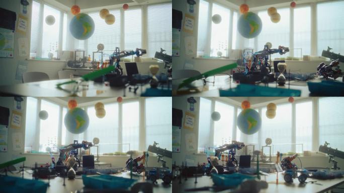 现代科学教室，悬挂的太阳系模型，3D 打印机，机器人手臂。