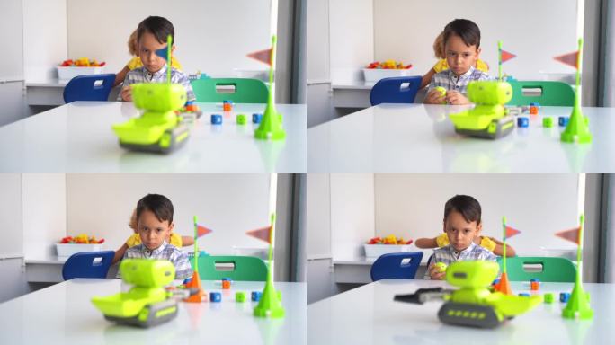 孩子们在STEM教育课堂上玩玩具车控制面板。