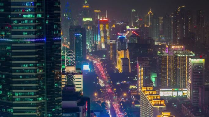 深圳，中国 - 2024年11月7日：繁华的城市天际线灯光在夜晚璀璨闪耀，映照着热闹的城市景观。