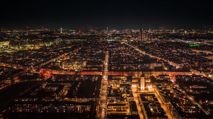 德国科隆夜景航拍，生机勃勃的城市风光，灯光璀璨的街道和建筑。