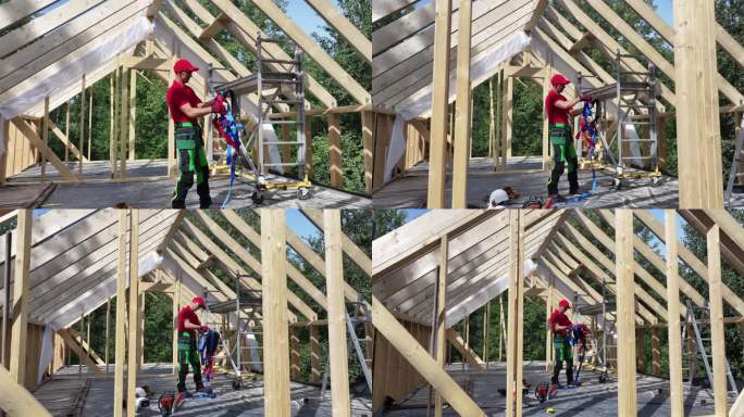 建筑工人在白天的住宅区屋顶上工作时使用安全带。