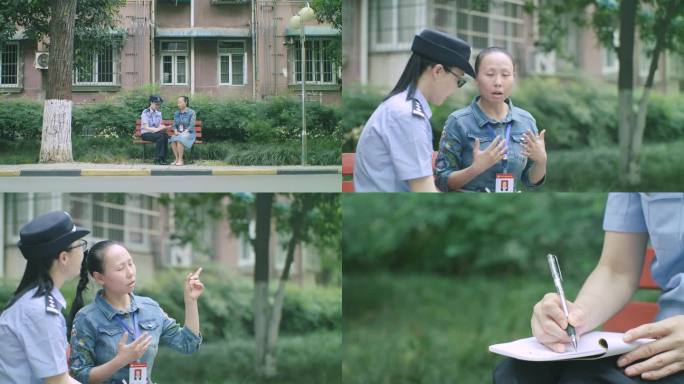 女民警和社区志愿者交流问询记录登记取证