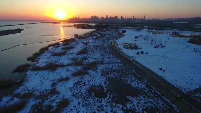航拍安徽合肥冬天雪后雪景夕阳滨湖湿地公园