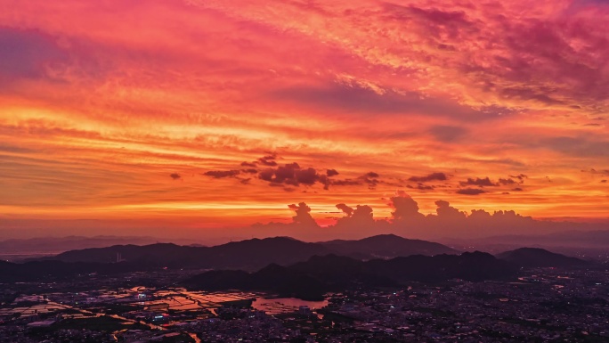 航拍城市夜幕的壮美云霞夕阳火烧云背景素材
