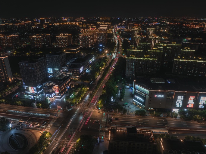 上海奉贤传悦坊苏宁广场路口夜景车流延时