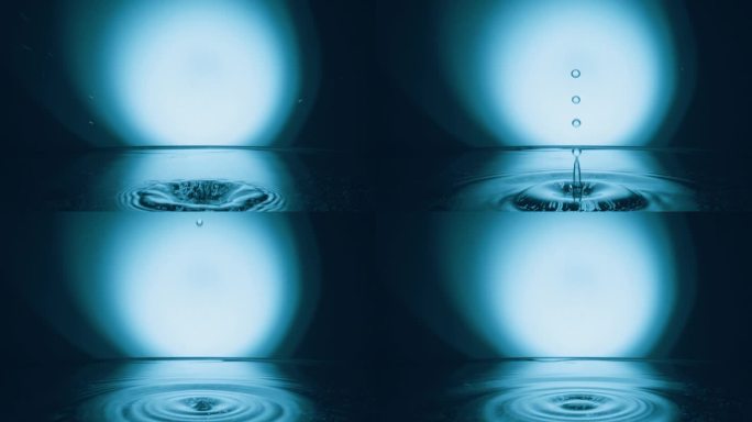 水滴溅入平静的水面，慢动作。