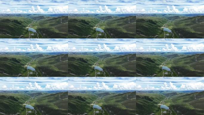 航拍蓝天白云下的四川莲宝叶则群山风光