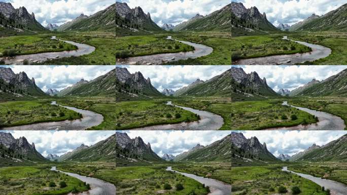 蓝天白云下莲宝叶则山谷中的湖水草地