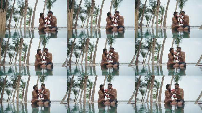 情侣在无边泳池旁吃西瓜