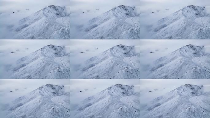 航拍云雾中雪山水墨山峰