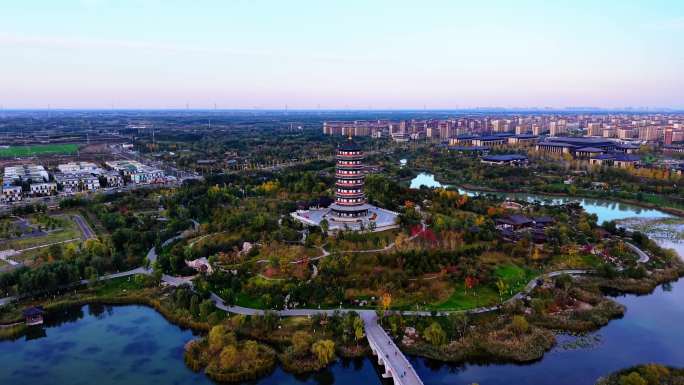 河北雄安新区公园湖水古塔夕阳秋景