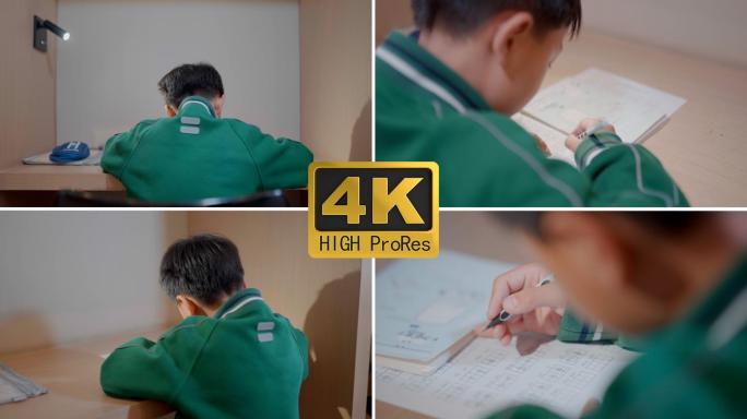 放学孩子认真写家庭作业 学业辛苦升学压力