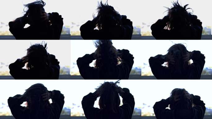 女性压力大烦躁抓头发情绪失控抓狂