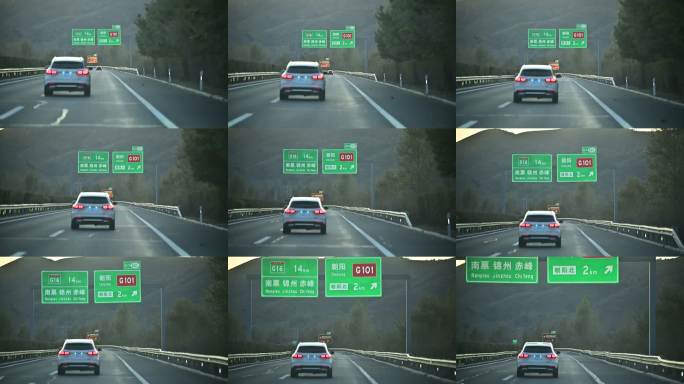 车辆行驶在高速路牌下自驾游