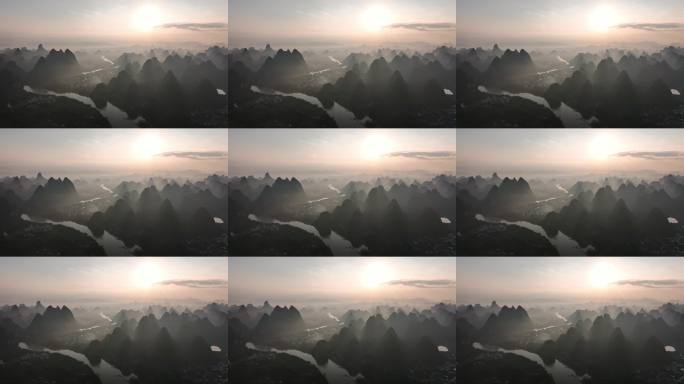 航拍日出阳光下阳朔喀斯特地貌蜿蜒的漓江