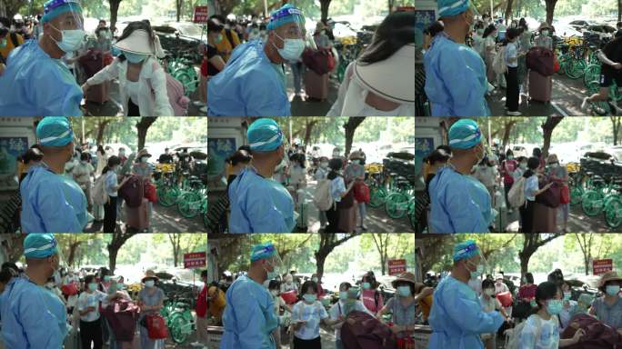 医护人员指导排队核酸检测