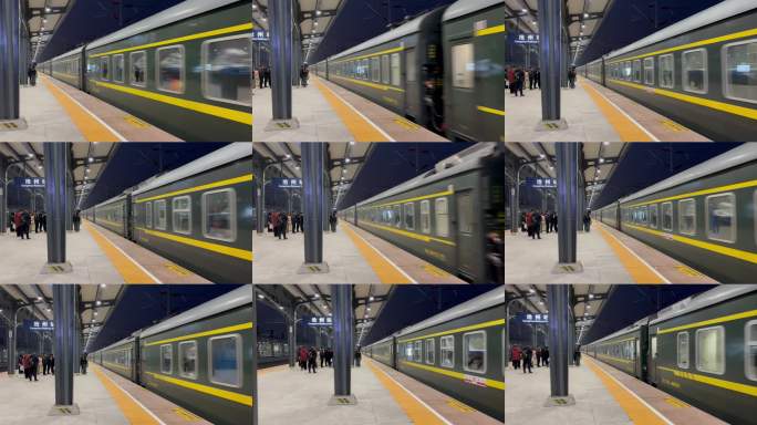 夜晚火车站台停靠的绿皮火车