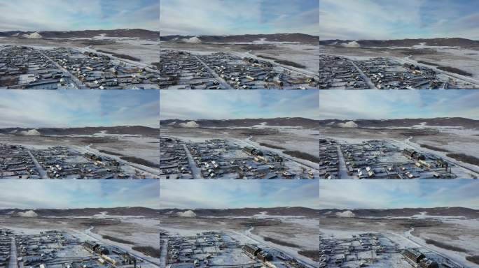 雪后村庄航拍全景冬日冷暖交织