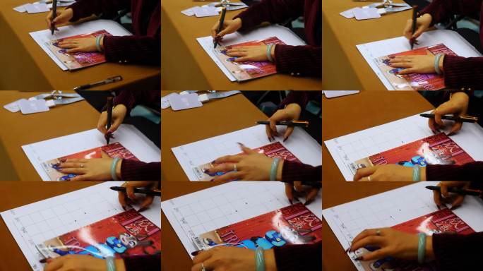 女性手写办公桌面书写场景特写