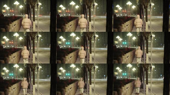 雪夜里往前走的女人背影